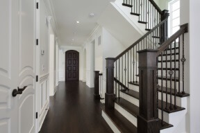 nice staircase with dark wood stair treads and dark hardwood floor
